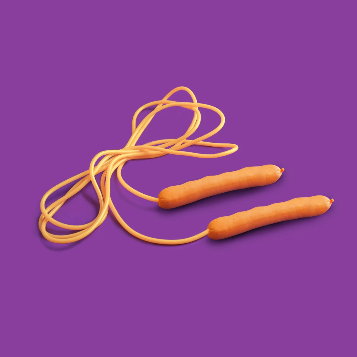 A skipping rope curled on a purple background
