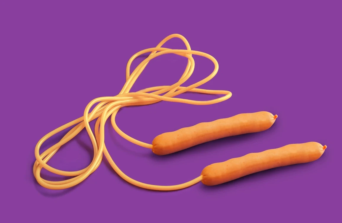A skipping rope curled on a purple background